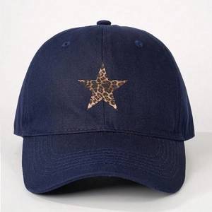 Detailed close-up of navy blue baseball cap featuring a leopard print star patch and stitching