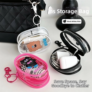 Detail of transparent PVC mini storage pouches with cartoon designs and metal hooks