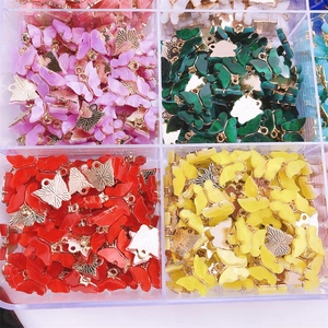 Colorful acrylic butterfly pendants in storage box for creative DIY jewelry making