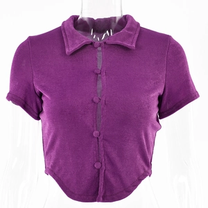 Detail view of purple short cardigan with sheer vertical panel and curved cropped hemline