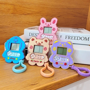 Close-up of colorful cartoon animal electronic pet machines with LCD screens and hooks