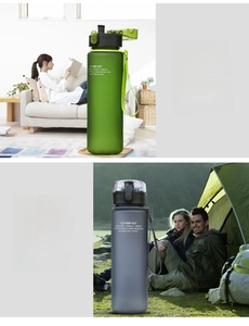 Detail view of large frosted sport bottle with locking lid and portable carrying strap