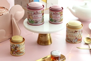 Detailed macro view of illustrated bunny tin cans on a decorative marble and pink display