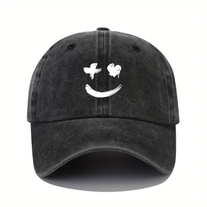 Vintage black washed denim baseball cap featuring a white graffiti smiley face pattern