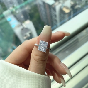 Macro shot of a sparkling rectangle cut zircon ring with radiant ice flower facets