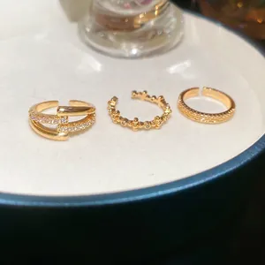 Three-piece 18k gold plated adjustable ring set featuring pave zircon and beaded designs