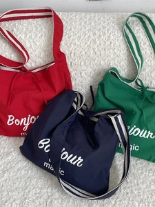Three large casual striped canvas tote bags with Bonjour magic print in red navy and green