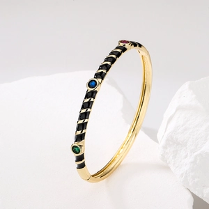 Boho-Armreif gold vergoldet mit schwarzer Emaille und bunten Zirkonia-Steinen