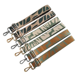 Adjustable woven cotton shoulder straps with colorful leaf patterns and metal hardware
