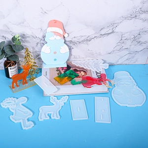 Macro detail of silicone molds for Christmas resin crafts with finished reindeer figures