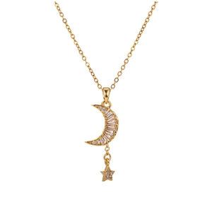 Detail of gold crescent moon and star pendant necklace with cubic zirconia inlay