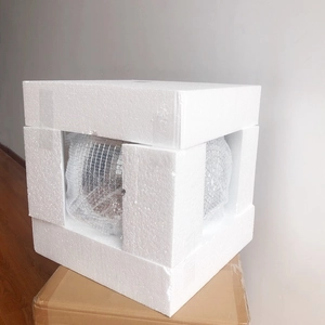 Detail showing red disco mirror ball protected by bubble wrap and custom foam packaging