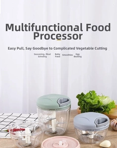Detail of manual food processor with stainless steel blades and colorful lids in kitchen