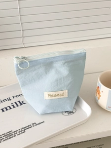Sky blue minimalist fabric cosmetic storage bag with zipper and gold logo