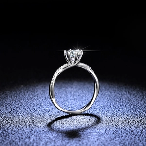 Luxurious six-prong moissanite ring with round brilliant cut diamond in silver finish