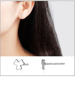Detail of S999 sterling silver clover stud earring showing high-polish finish and hallmark