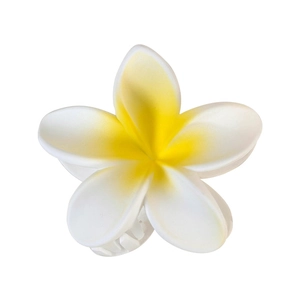 Realistic white plumeria hair claw clip with yellow center for summer beach hairstyles