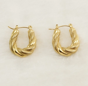 Detailed view of chunky 18K gold plated twisted rope earrings with a braided texture