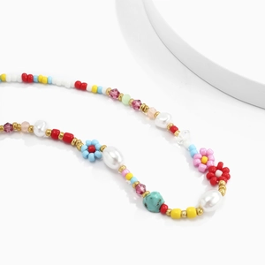 Bohemian colorful beaded necklace featuring white pearls and floral beads for summer vacation
