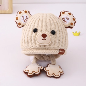 Detailed knit texture and DO Bear embroidery on beige bear-shaped winter hat
