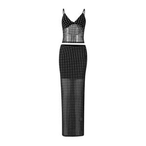 Detailed view of black mesh two-piece set featuring white polka dots and sheer texture
