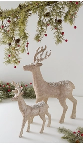 Sparkling champagne gold reindeer figurines with glitter finish and snow effect ornaments