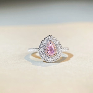 Minimalist S925 sterling silver ring with pear-cut pink gemstone and halo setting