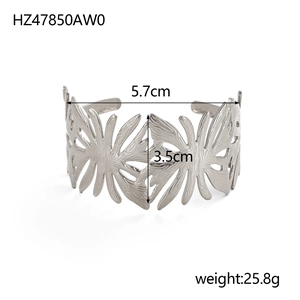Detail view of silver hollow leaf bangle with dimensions 5.7cm diameter and 3.5cm height