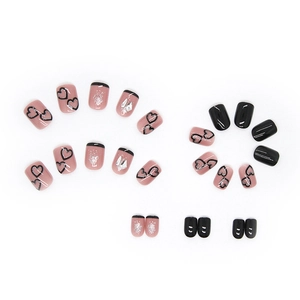 Sparkly black heart press-on nails set with glitter accents and French tip design