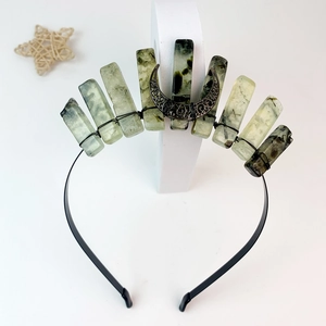 Detailed macro view of the handcrafted triple moon crown with natural raw green crystals