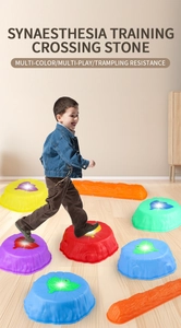 Detailed close-up of a child stepping on colorful non-slip EPP balance stones and beams