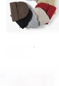 Detailed view of striped knit beanies in multiple colors with thick cable knit texture