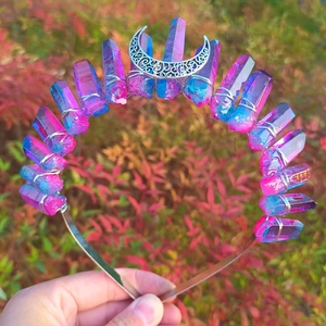 Detailed shot of wicca crown featuring pink-blue gradient crystals and silver moon charm