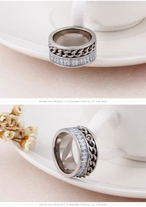 Detail of cubic zirconia paved link ring featuring a stylish dual-layer industrial design