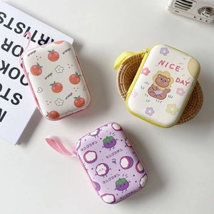 Three cute hardshell storage cases for earphones and chargers with fruit patterns