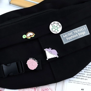 Canvas waist bag decorated with math animal pins, tortoise protractor and hippo pins