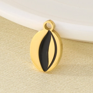 Macro shot of 18K gold plated oval evil eye pendant with black enamel inlay details