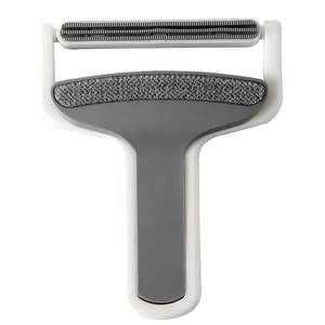 White T-shaped portable lint remover with gray fabric brush and double-sided serrated head