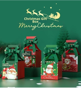 Detailed view of Christmas apple gift boxes with Santa illustrations and large ribbon bows