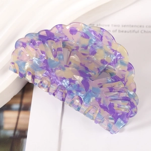 Shell shaped colorful acetate hair claw clip with purple and blue marble pattern