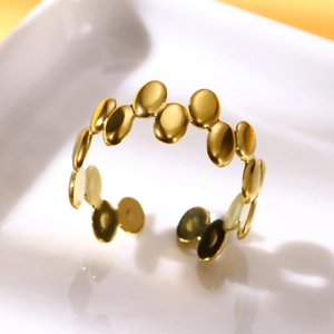 Detailed view of the gold-plated irregular geometric stainless steel open ring design
