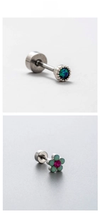 Detail view of titanium steel opal piercing studs featuring flower and round designs