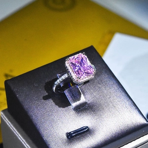 Luxurious silver ring with princess cut pink crystal and yellow diamond accents