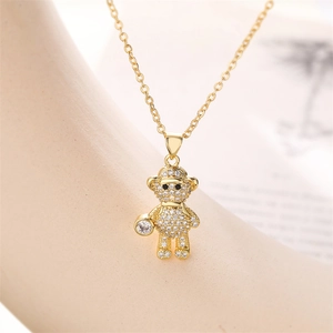 Macro shot of a golden teddy bear pendant featuring full pavé zircon stones on an O-chain