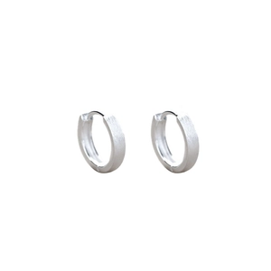 Minimalist 999 sterling silver hoop earrings with brushed matte finish on white background