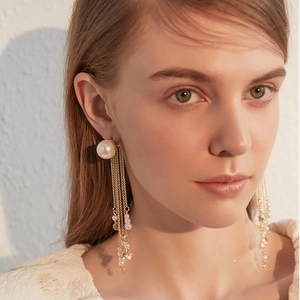 Vintage pearl tassel drop earrings with gold stars and butterfly charms for women