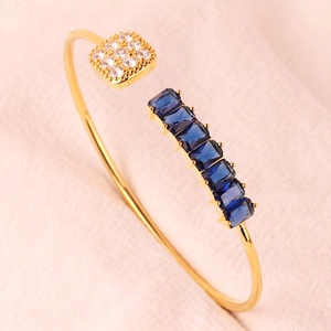 Verstelbare gouden armband met blauwe edelstenen en witte zirkonia details