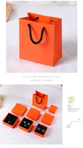 Orange jewelry gift boxes and paper bag set with black ribbon detail and soft inner lining