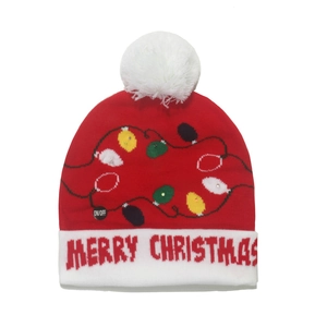 Close-up of red knit Christmas hat with LED lights and Merry Christmas text embroidery