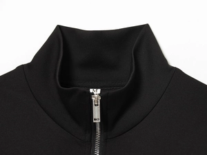 Close-up of black stand-collar tracksuit jacket with high-quality silver metal zipper